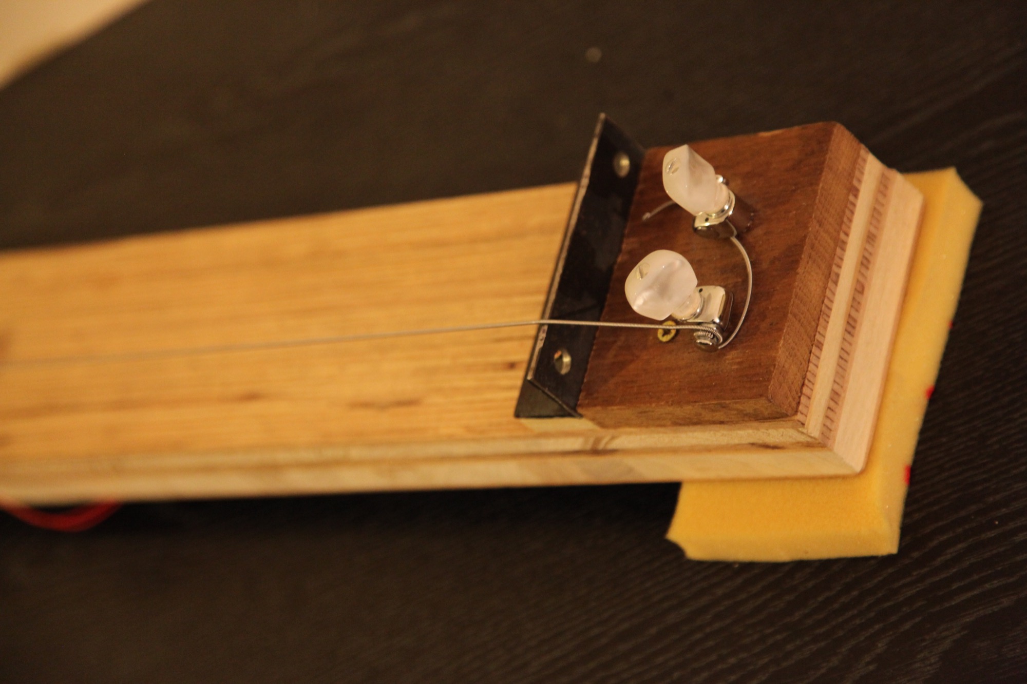 Close up of the tuning mechanism and the dented steel nut