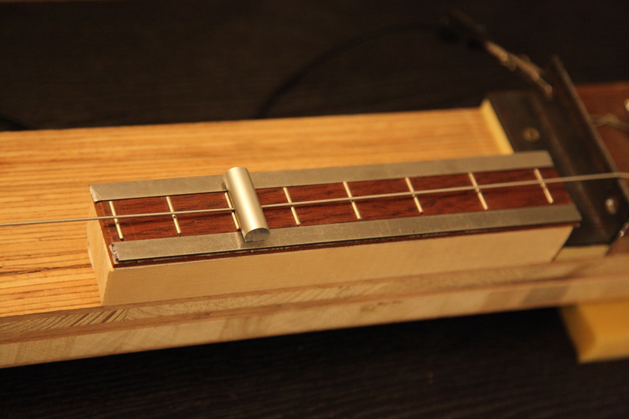 The fretboard with its steel rails